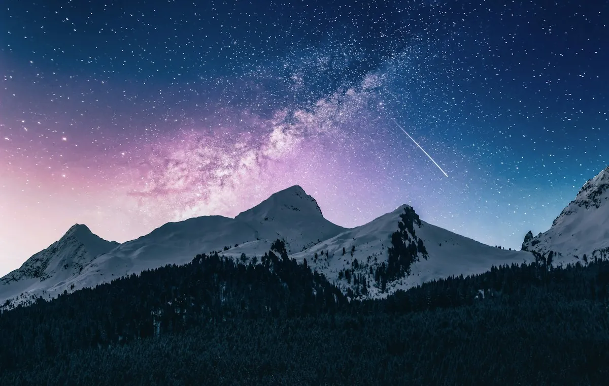 Mountain peaks beneath a wide open sky